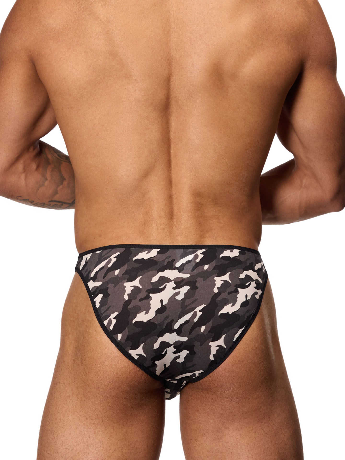 Rear view of a male model wearing a black and white camouflage brief with black binding