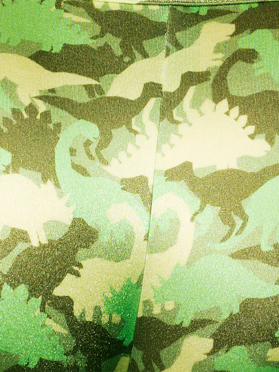 Closeup view of green fabric with a camo pattern made of dinosaur shapes