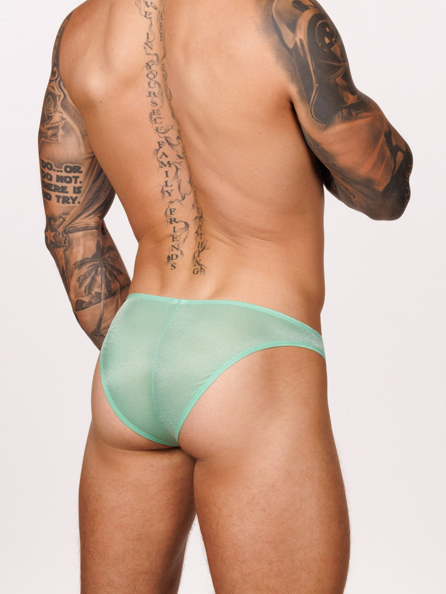 Back view of a male model wearing green Body Aware briefs