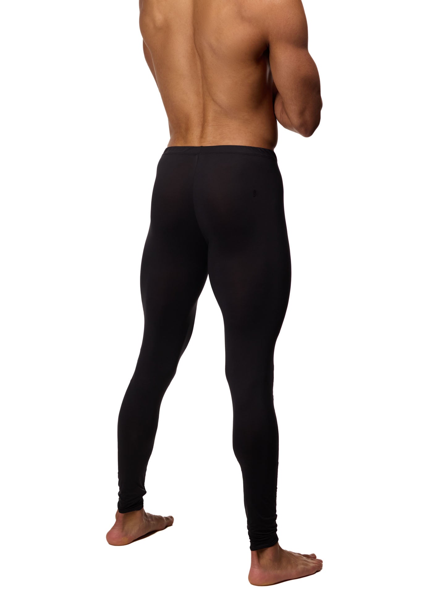 Rear side view of a male model wearing black Body Aware leggings