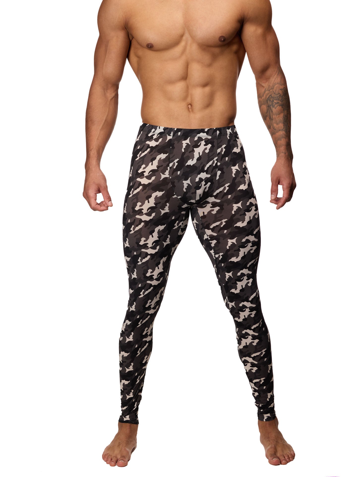 Front view of a male model wearing black and white camouflage leggings