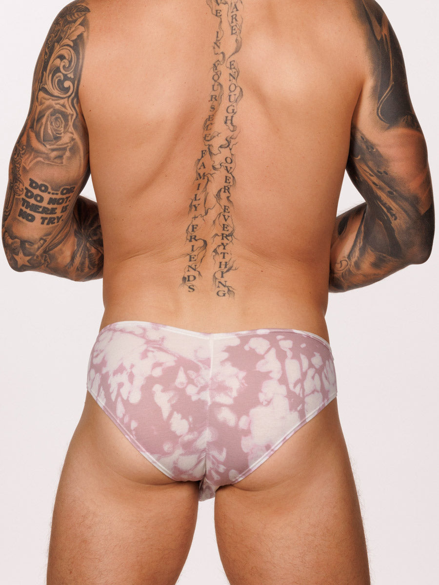 Back view of a male model wearing a pink & white Body Aware brief