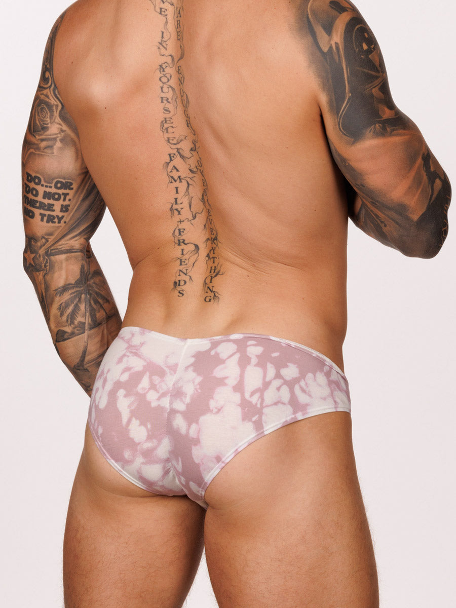 Back view of a male model wearing a pink & white Body Aware brief