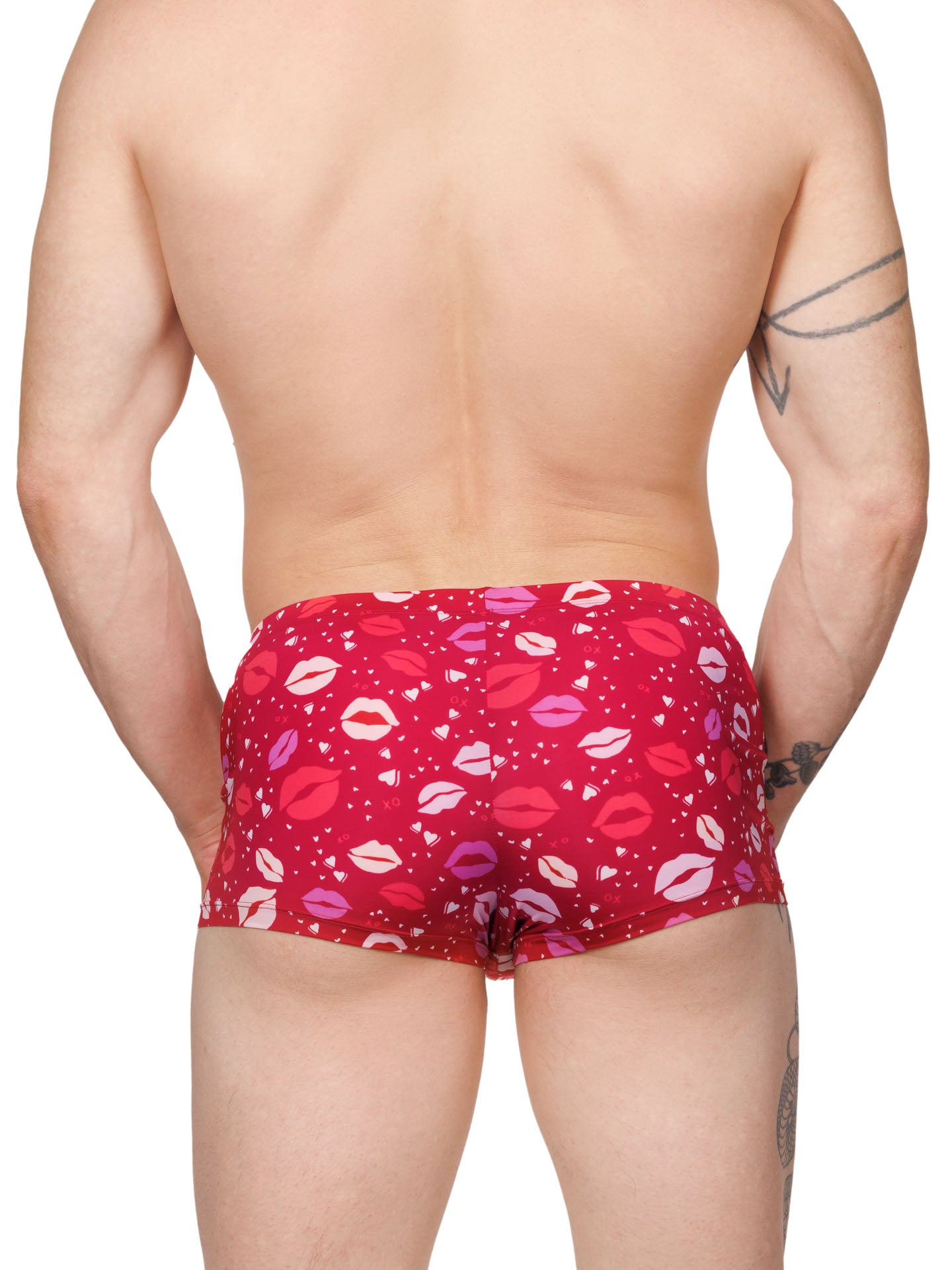 Back view of a male model wearing red Body Aware boxer shorts with a lipstick kiss pattern