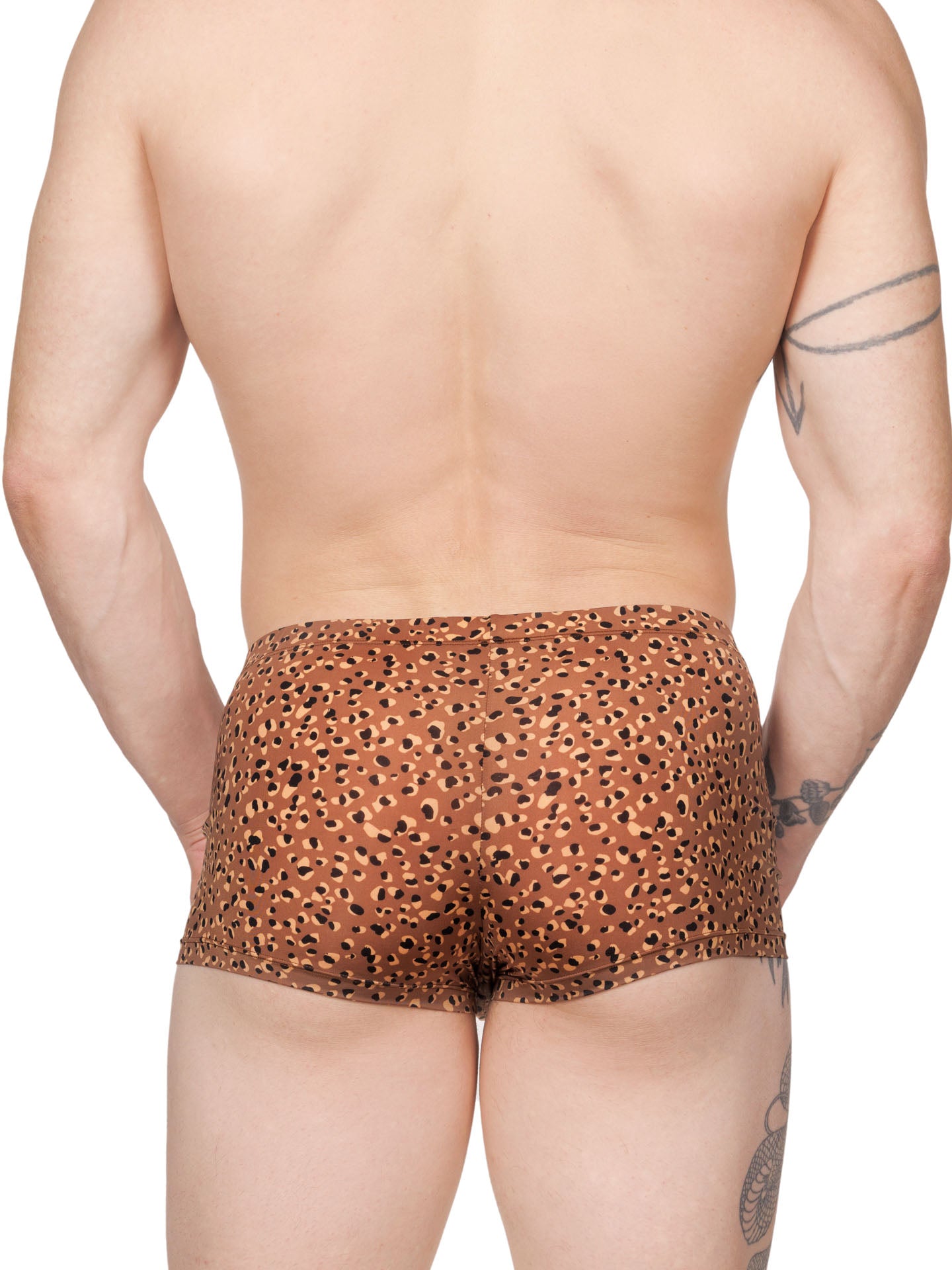 Back view of a male model wearing brown Body Aware boxer shorts with a leopard spot pattern