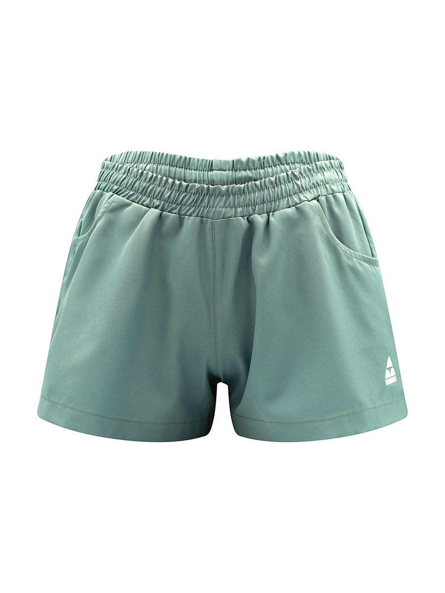 Green shorts with a brand logo on a white background