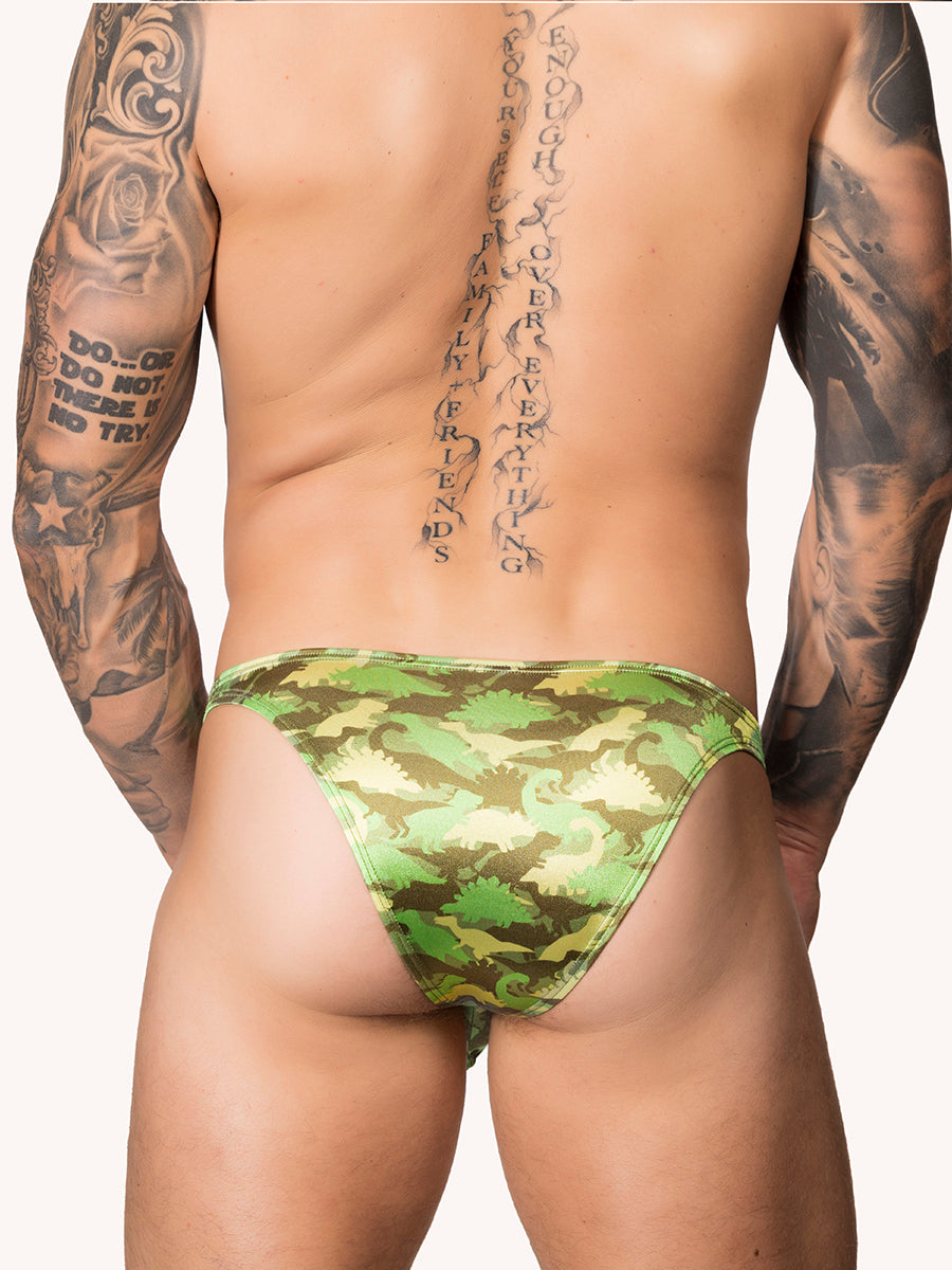 Back view of male model wearing a green satin Body Aware bikini brief with camo pattern