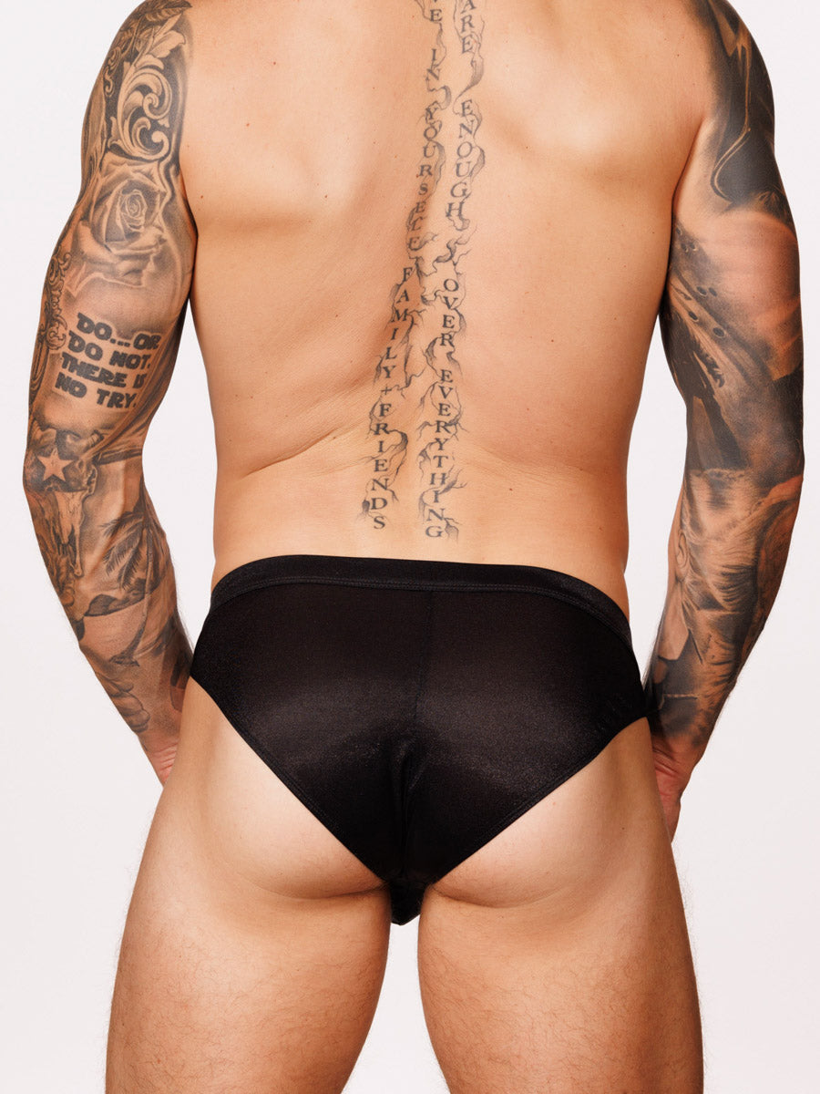 Back view of a male model wearing black Body Aware briefs