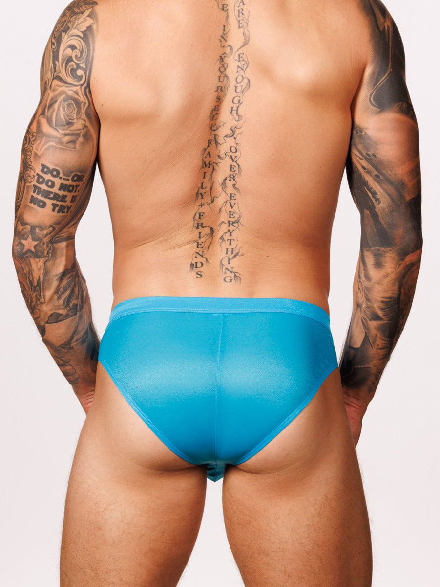 Back view of a male model wearing blue Body Aware briefs