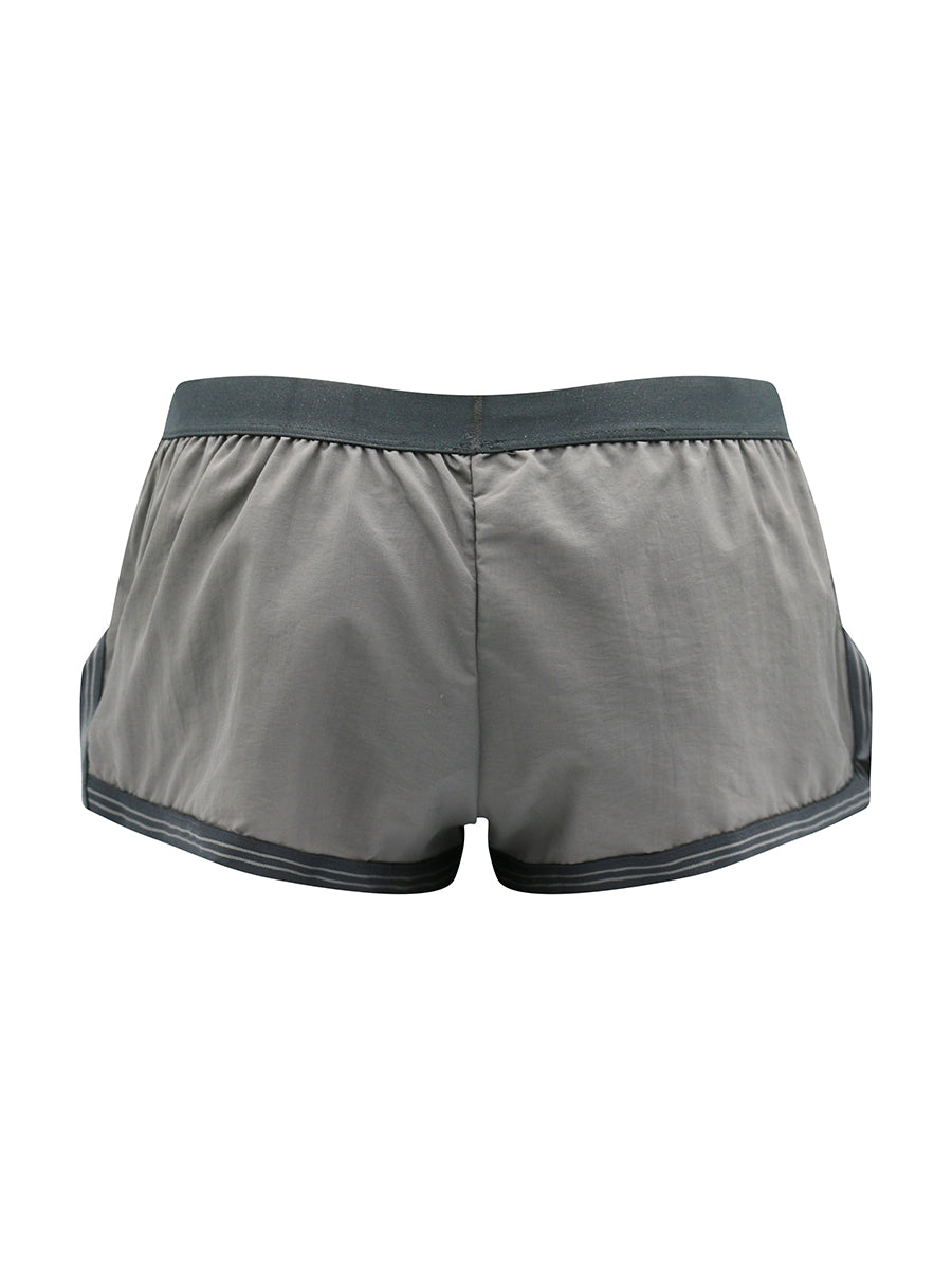 Rear view of grey athletic shorts with a black waistband on a white background.