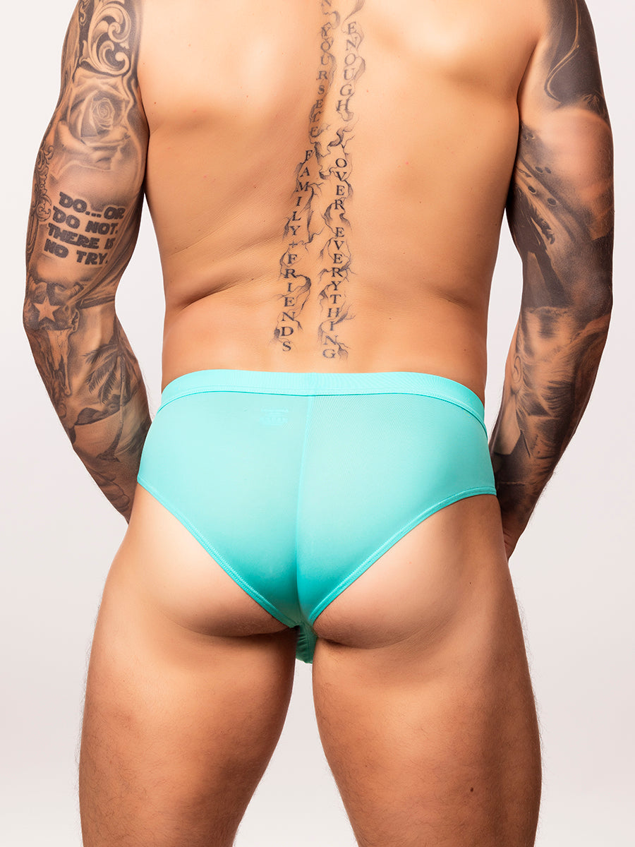 back view of a man wearing a light aqua body aware glow thrust brief