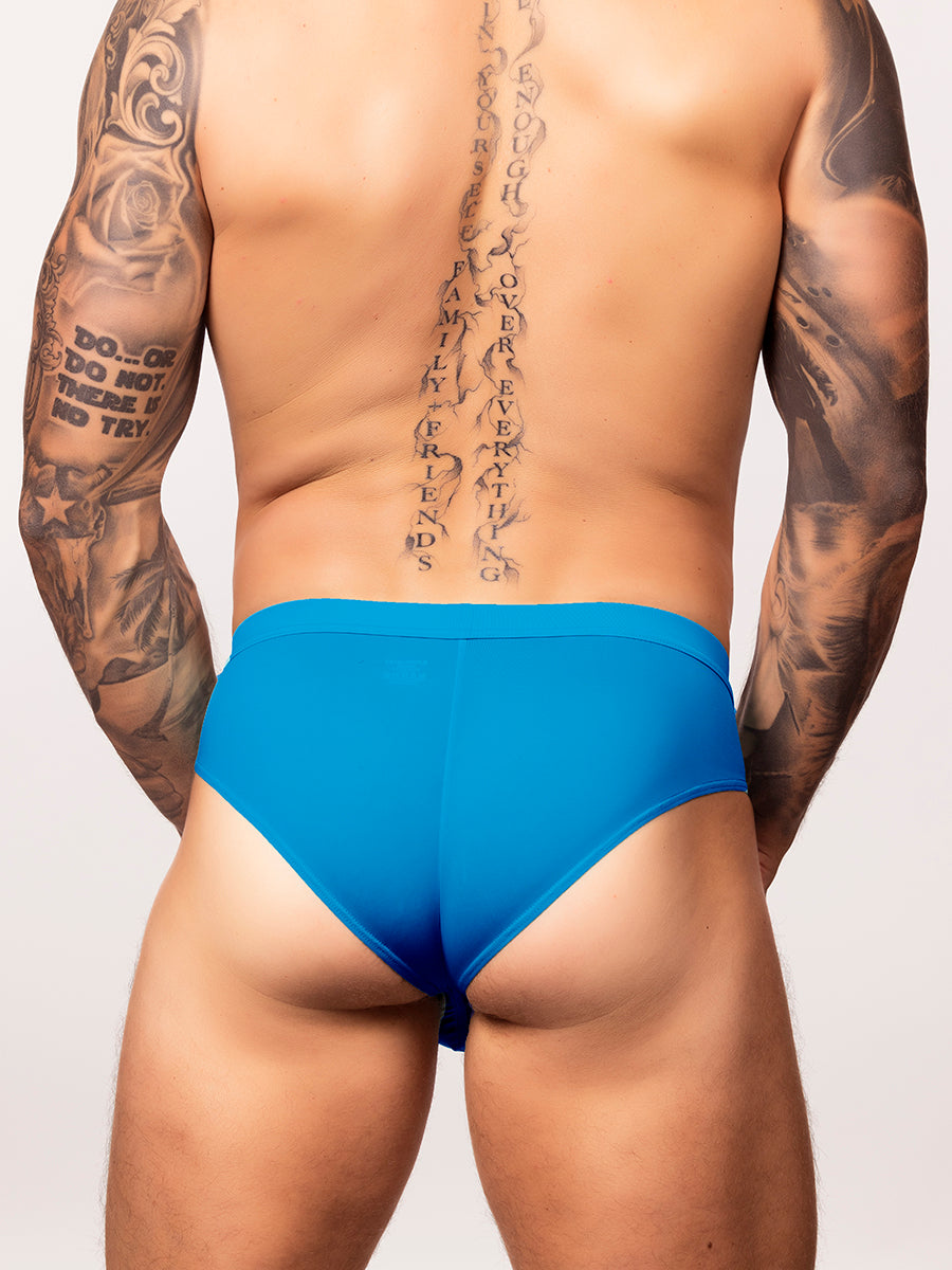 back view of a man wearing a bright blue body aware glow thrust brief