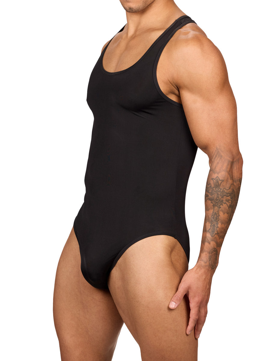 Side view of a muscular male model wearing a black Body Aware brief bodysuit