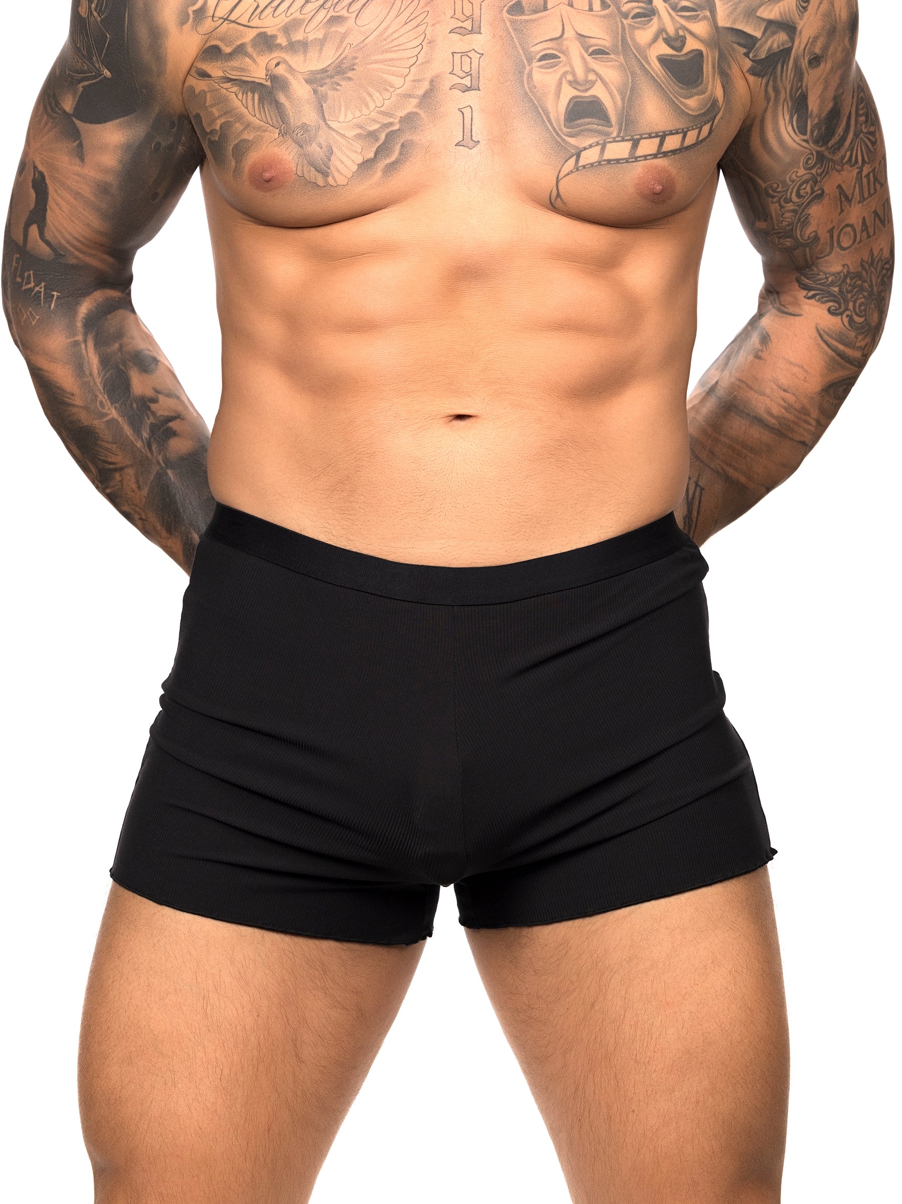 Front view of a male model wearing black Body Aware shorts