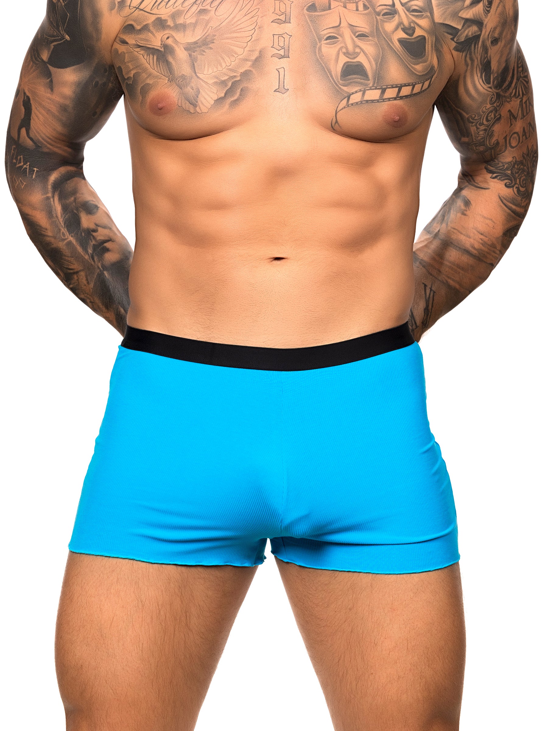 Front view of a male model wearing turquoise Body Aware shorts with black waistband