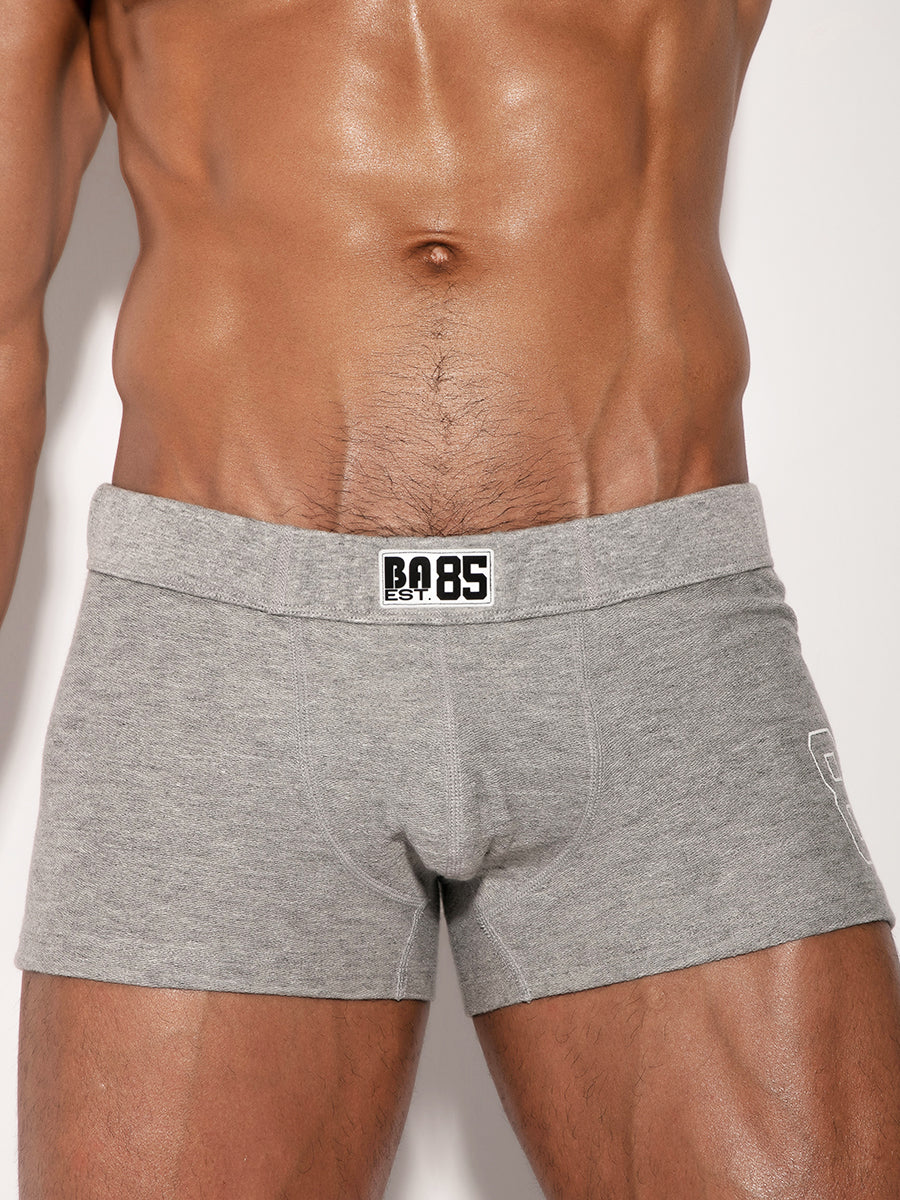 Gray booty short with a Body Aware Logo on a plain background