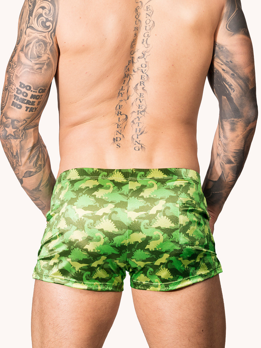 Back view of a male model wearing green Body Aware shorts with camo pattern