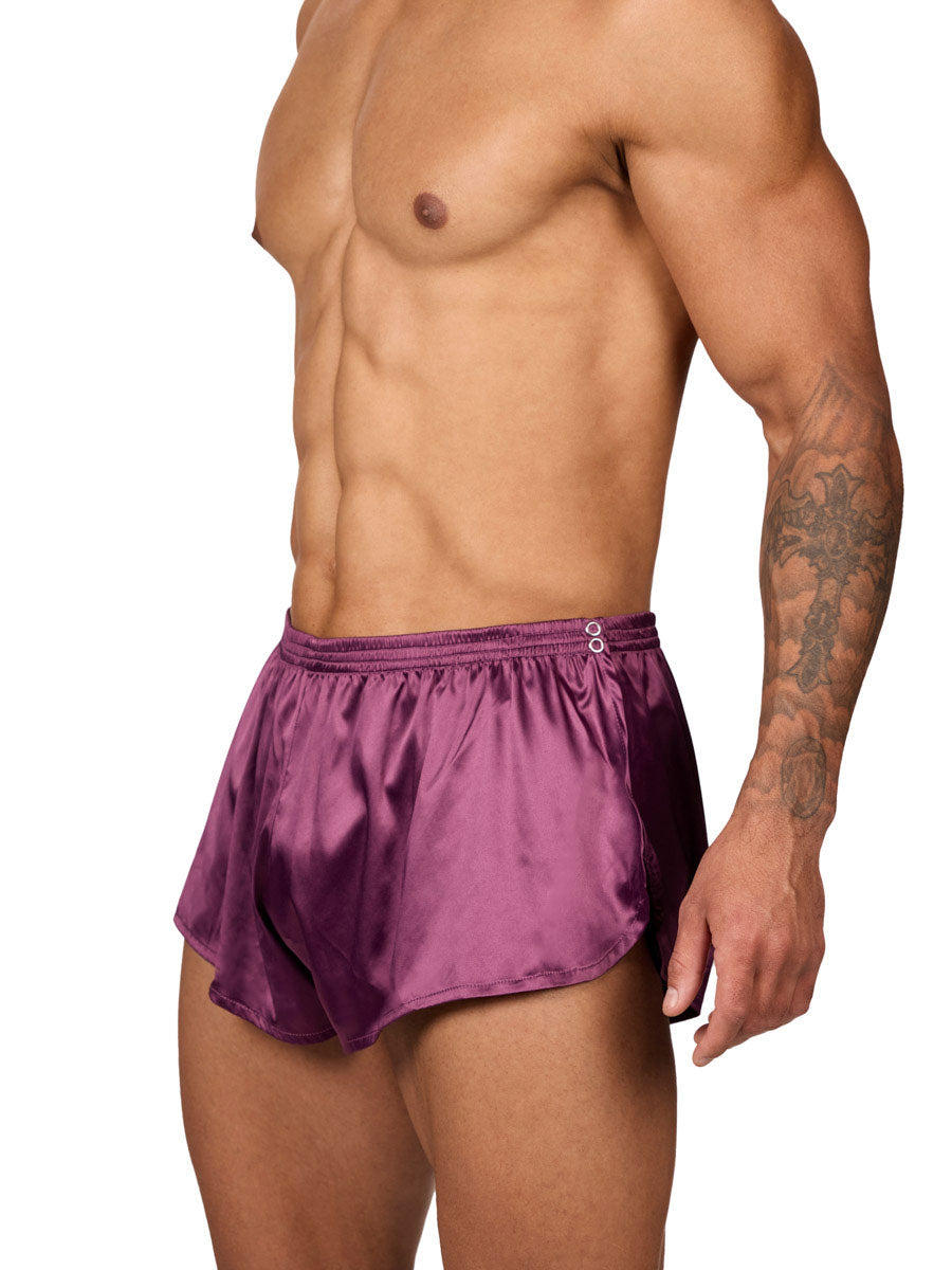 Side view of a male model wearing Body Aware purple men's tear away shorts