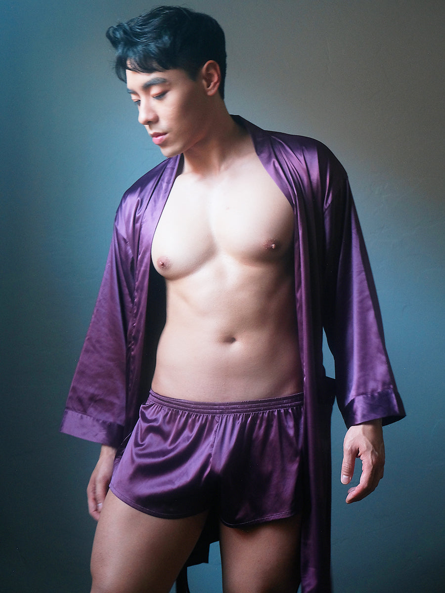 Front view of a male model wearing Body Aware purple men's tear away shorts and matching robe