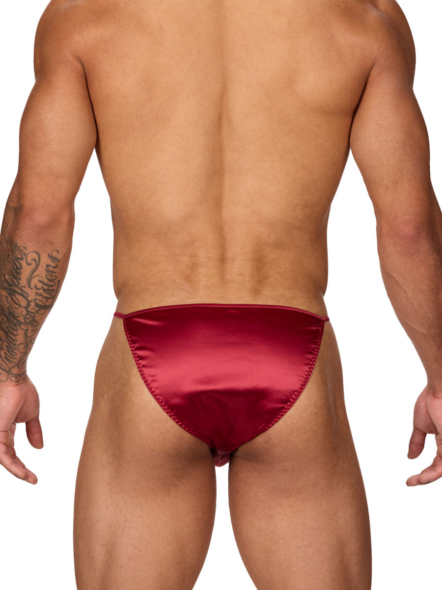 Back view of a male model wearing a Body Aware red men's bikini brief