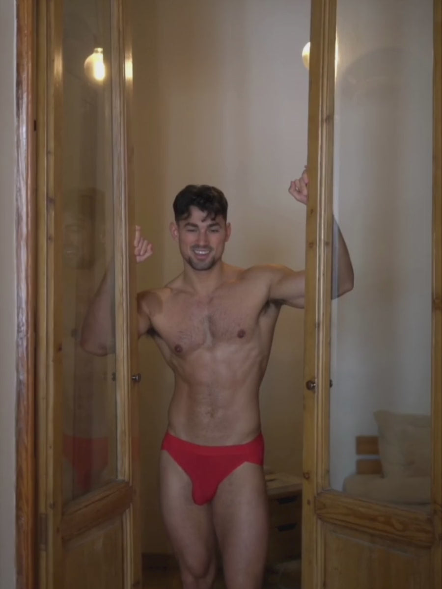 Video of a man wearing red Body Aware briefs