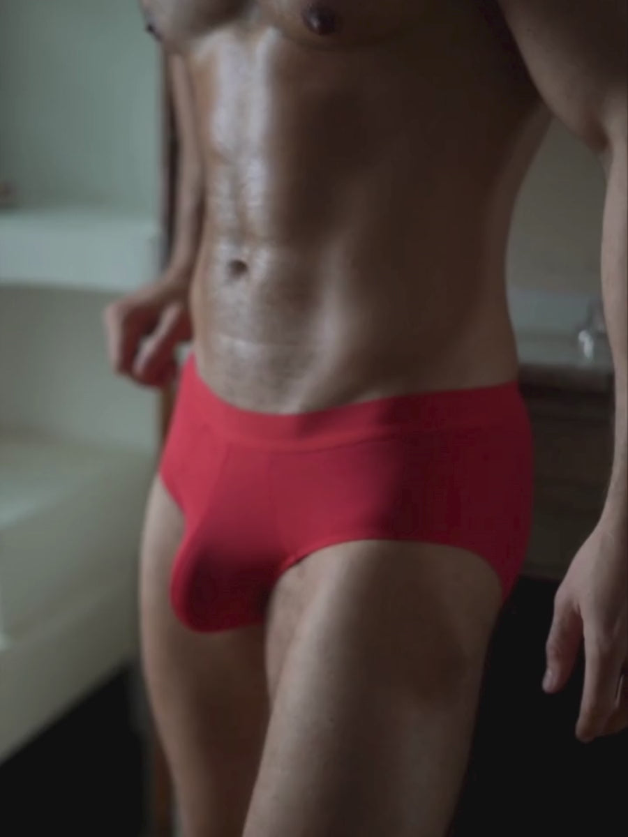 Video of a man wearing red Body Aware briefs
