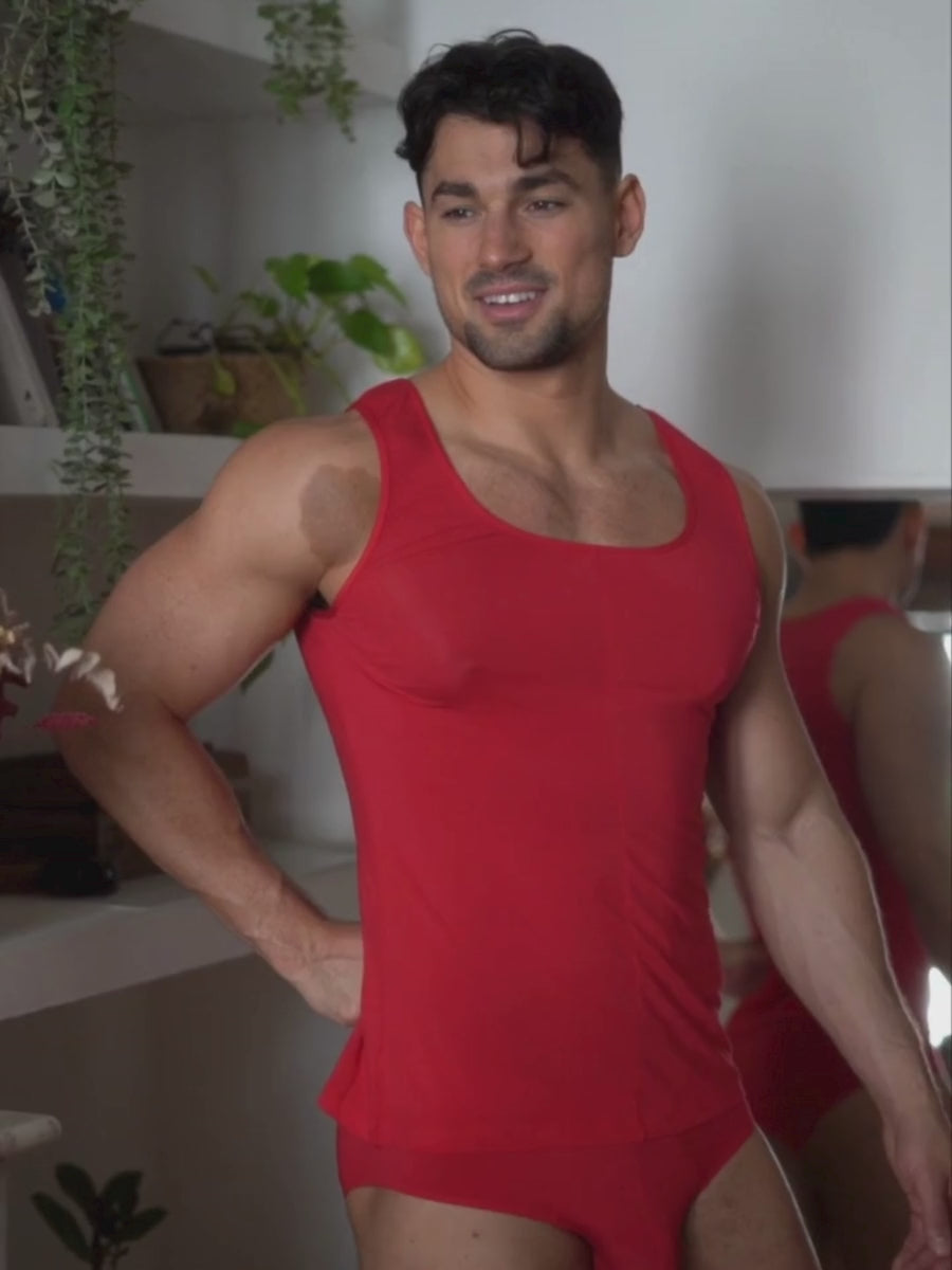Video of a man wearing a red tank top and matching Body Aware briefs